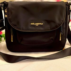Karl Lagerfeld Crossbody with luggage strap purse. Shiny gold trim.  Super cute!